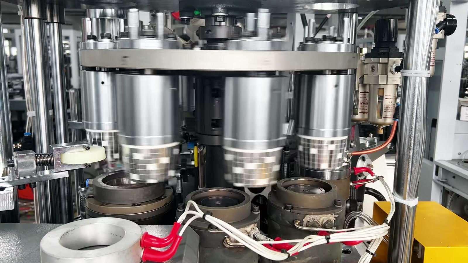paper cup forming stations during side-seam bonding